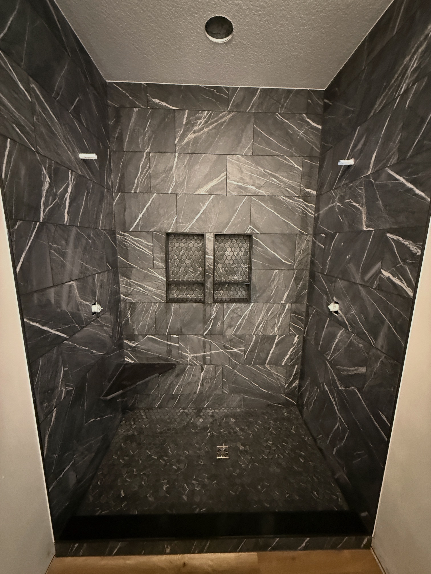 Dark stone-look custom shower