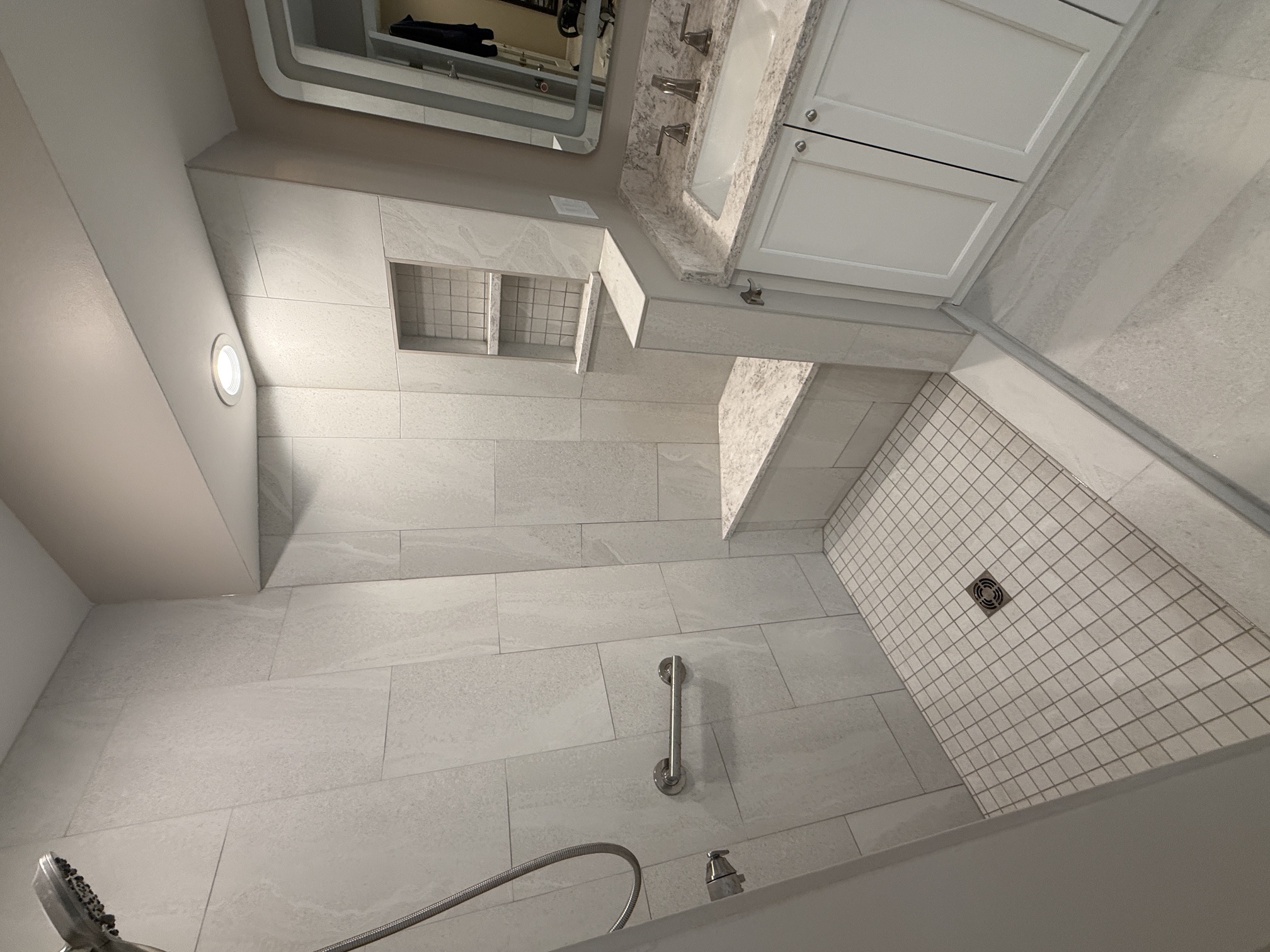 Accessible walk-in shower with bench and vanity